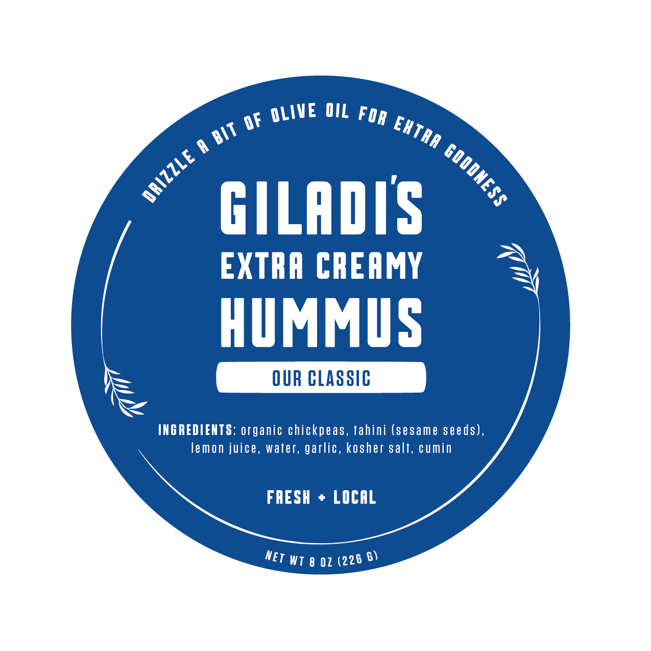 Label of Giladi's Extra Creamy Hummus with ingredients listed and instructions to drizzle olive oil for extra goodness.